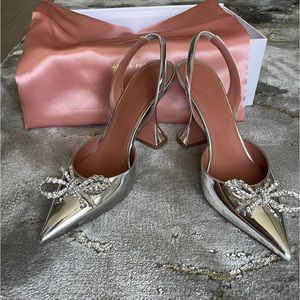 Amina Muaddi ROSIE mirror silver sling back heels with crystal bow.
